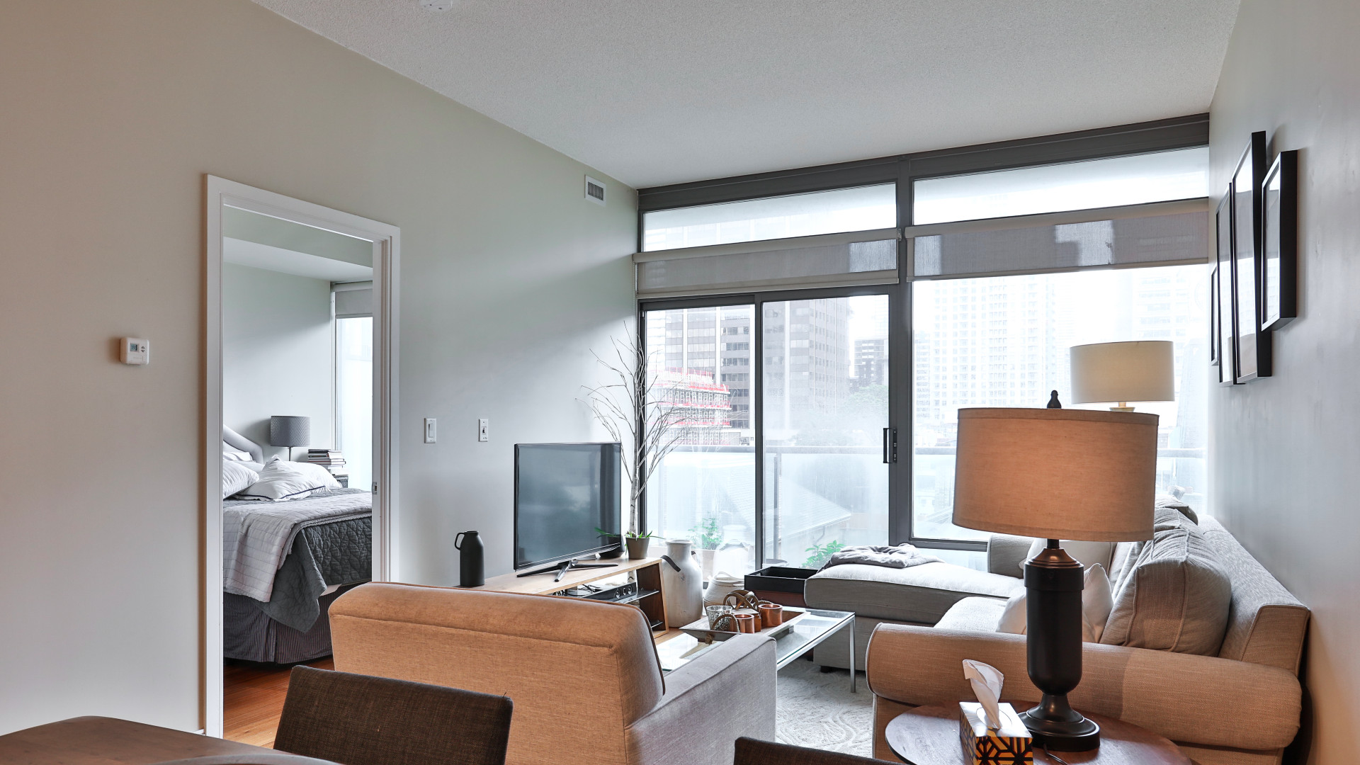 A photo of the living room leading to the balcony.