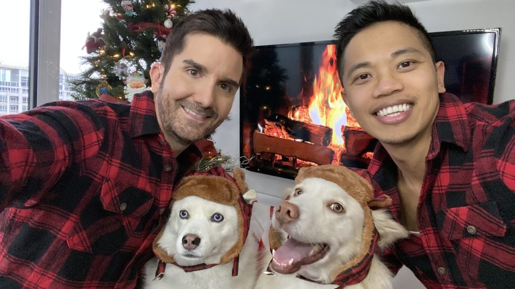 Global News meteorologist Ross Hull and partner Rodson Garcia with their dogs