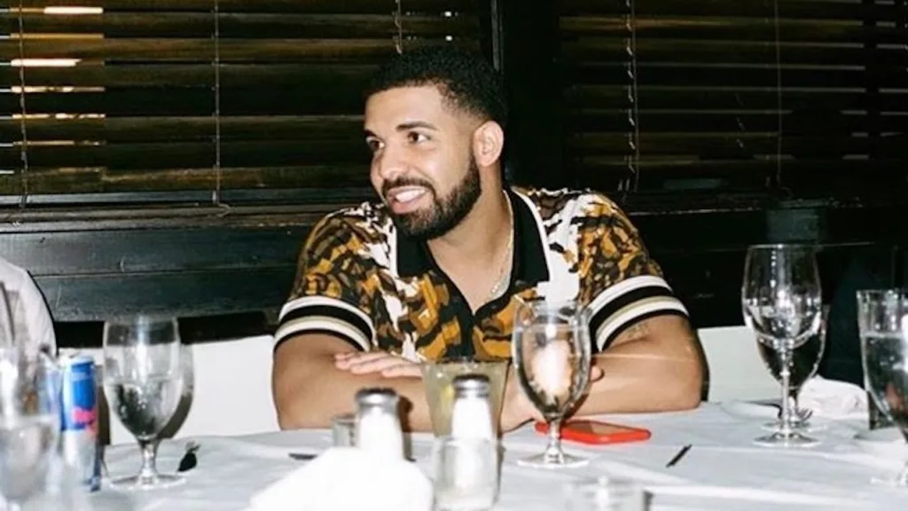 Drake sitting at a table