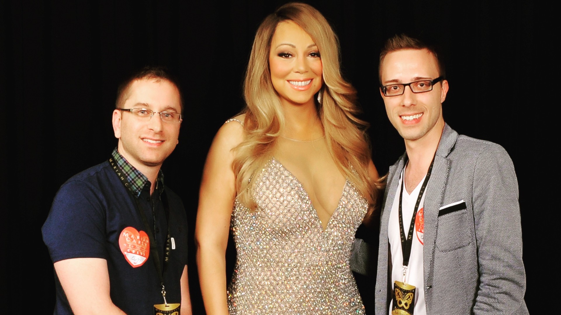 Maurie Sherman and Matthew Almeida pose with Mariah Carey after their proposal