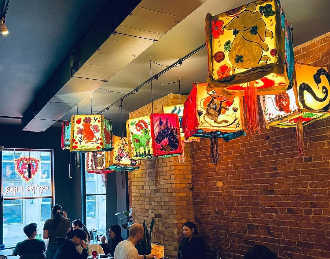The interior with hanging lanterns at Crying Tiger.