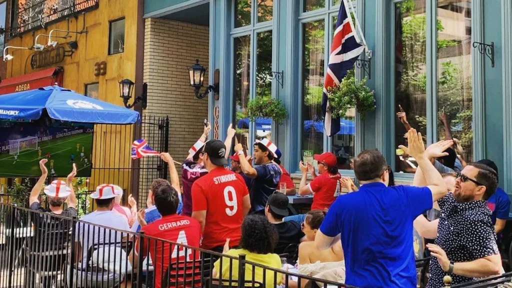 fans celebrating at Queen and Beaver