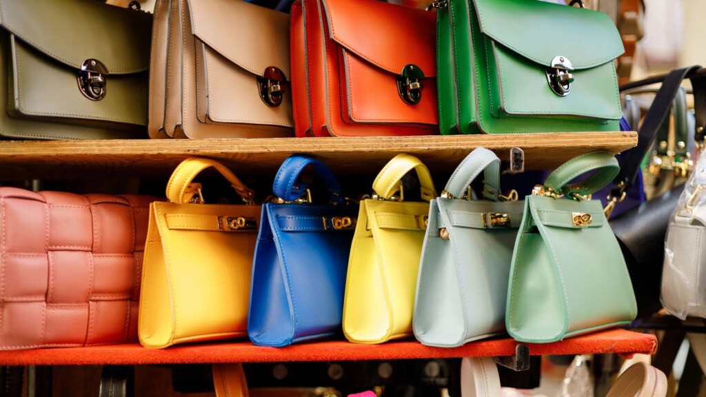 Close up of different leather bags on market Modern colorful bags for sale Womanly accessories
