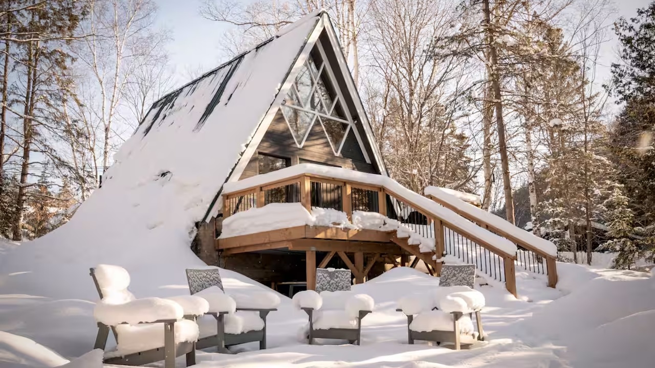 1970s-style Muskoka A-frame near Arrowhead Provincial Park This reimagined 1970s Muskoka A-frame is tucked away in Huntsville and is within a 15-minute drive of Arrowhead Provincial Park! After a day of skiing, relax in the dreamy hot tub, or admire the snowy landscape through the floor-to-ceiling, two-storey windows. It comes with modern conveniences: a gas fireplace, a decked-out kitchen with an espresso machine, and a clawfoot tub. Outside, you’ll find string lights, a fire pit (wood provided), comfy Muskoka chairs, a BBQ and even snowshoes. It’s just a short walk/drive to Ski Hidden Valley (with an unofficial ski-in/out access when conditions allow). Maximum of two guests with no pets. About 2.5 hours from Toronto.