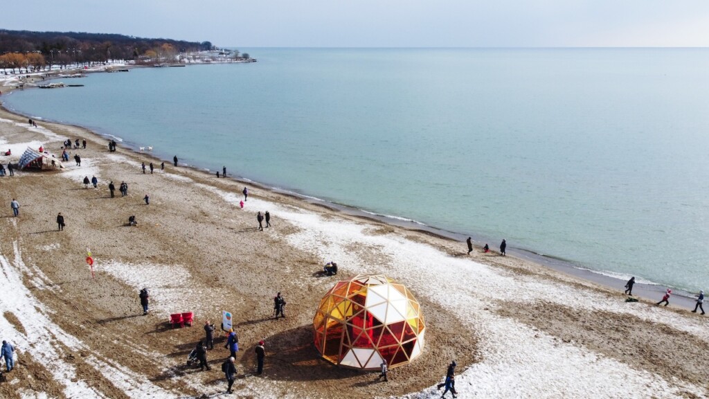 Aerial view of the Winter Stations 2022 exhibition, including The Hive by Will Cuthbert and Kathleen Dogantzis. Photo credit: Jonathan Sabeniano