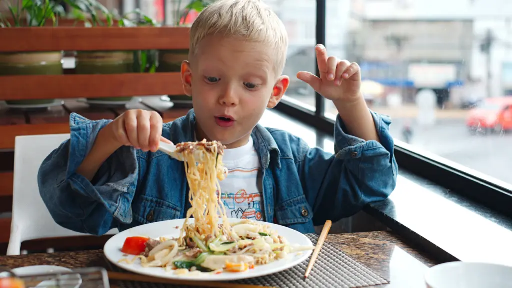 kid with pasta